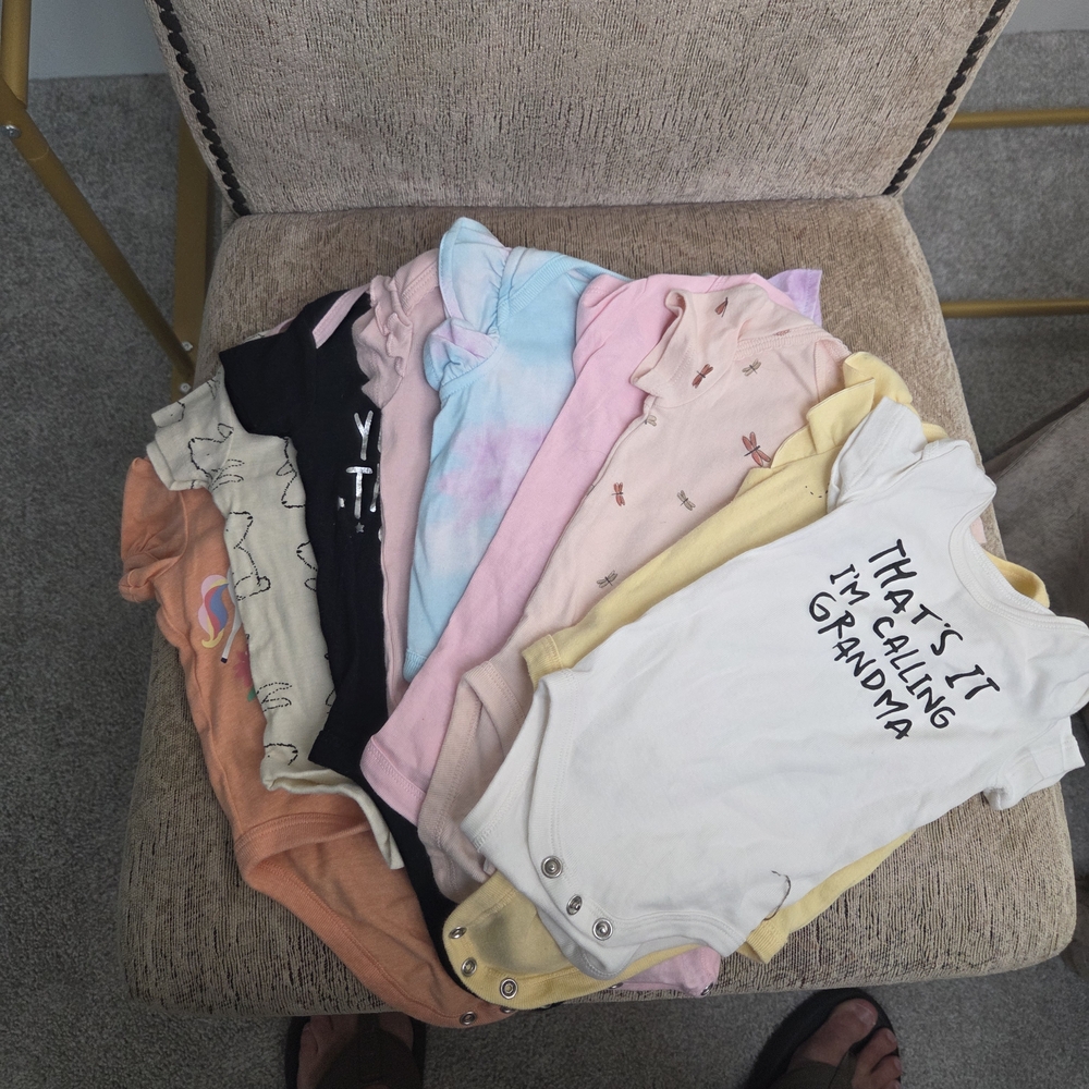 Lot Of 9 Assorted Short Sleeve onesies.